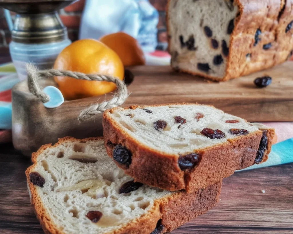 Fruity gluten free bread sliced and served with fresh fruits.
