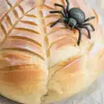 Creative spooky scored sourdough bread with Halloween-themed designs