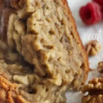 Moist and delicious Slow Cooker Gluten-Free Banana Bread served on a plate with bananas