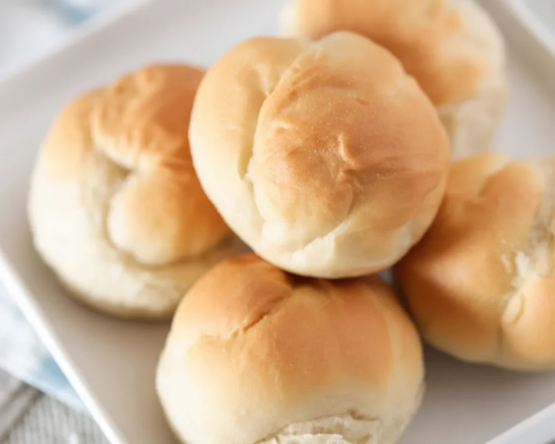 Freshly baked Vegan Gluten-Free Dinner Rolls on a baking tray.