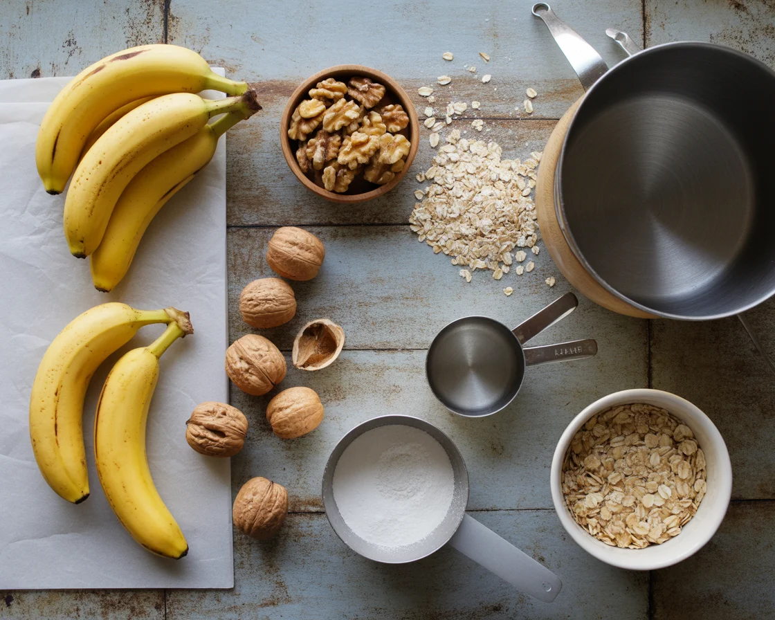 Ingredients for oat flour banana bread including ripe bananas, walnuts, oats, measuring cups, and mixing bowl on rustic surface.