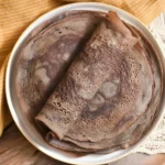 Delicious Teff Injera Flatbread served with traditional Ethiopian dishes.