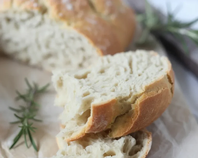 Homemade gluten free rosemary bread with a crispy crust and soft interior.