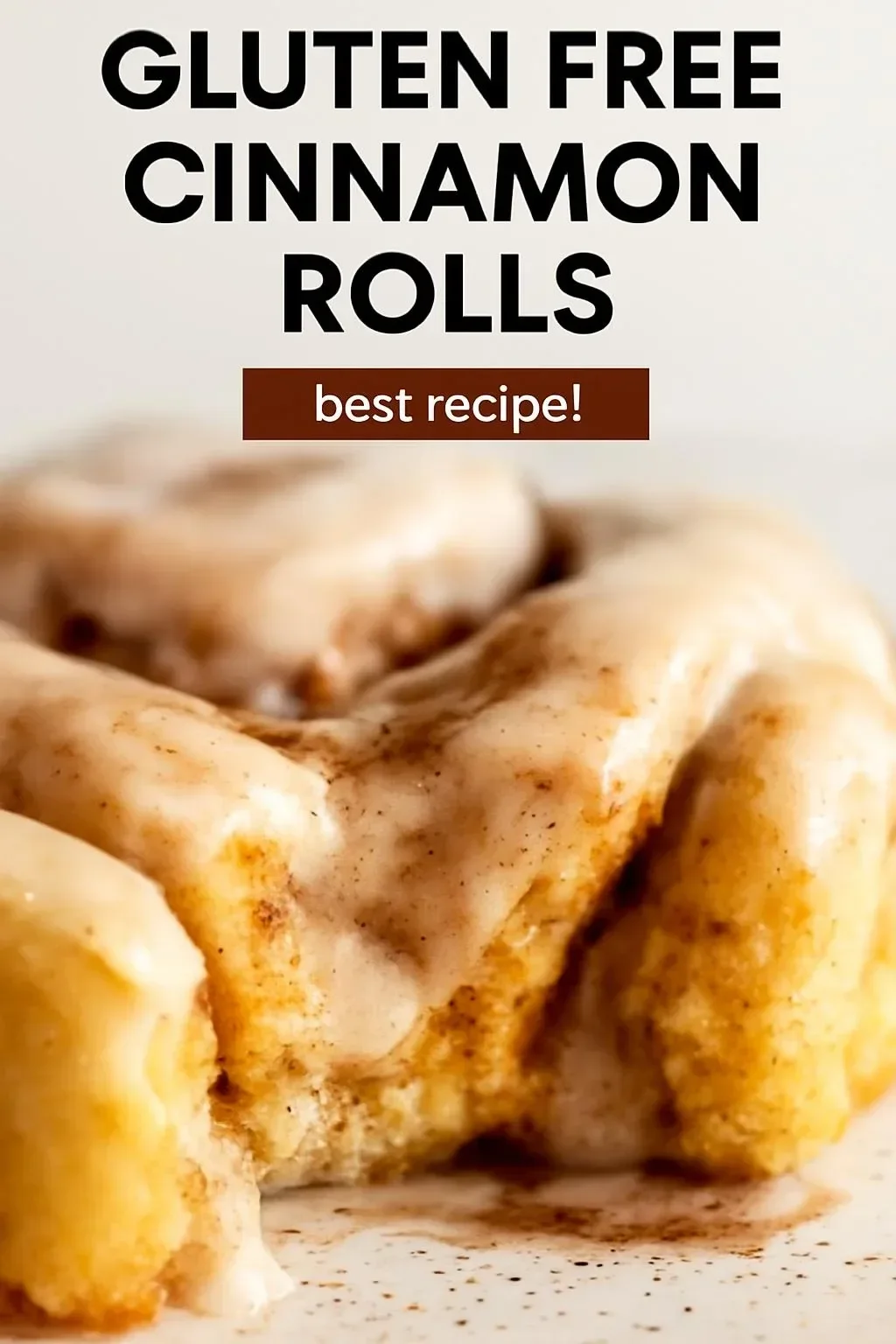 Delicious gluten free cinnamon rolls drizzled with icing on a plate