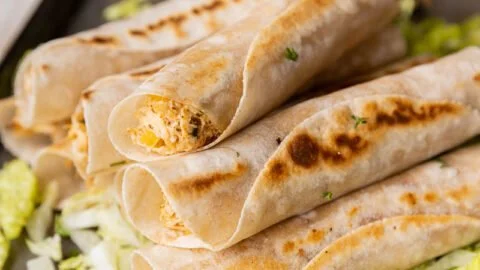 Delicious gluten-free chicken taquitos on a serving plate