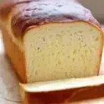 A loaf of gluten-free Japanese milk bread freshly baked and sliced