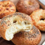 Homemade soft and chewy gluten-free bagels, perfect for breakfast or snacks.